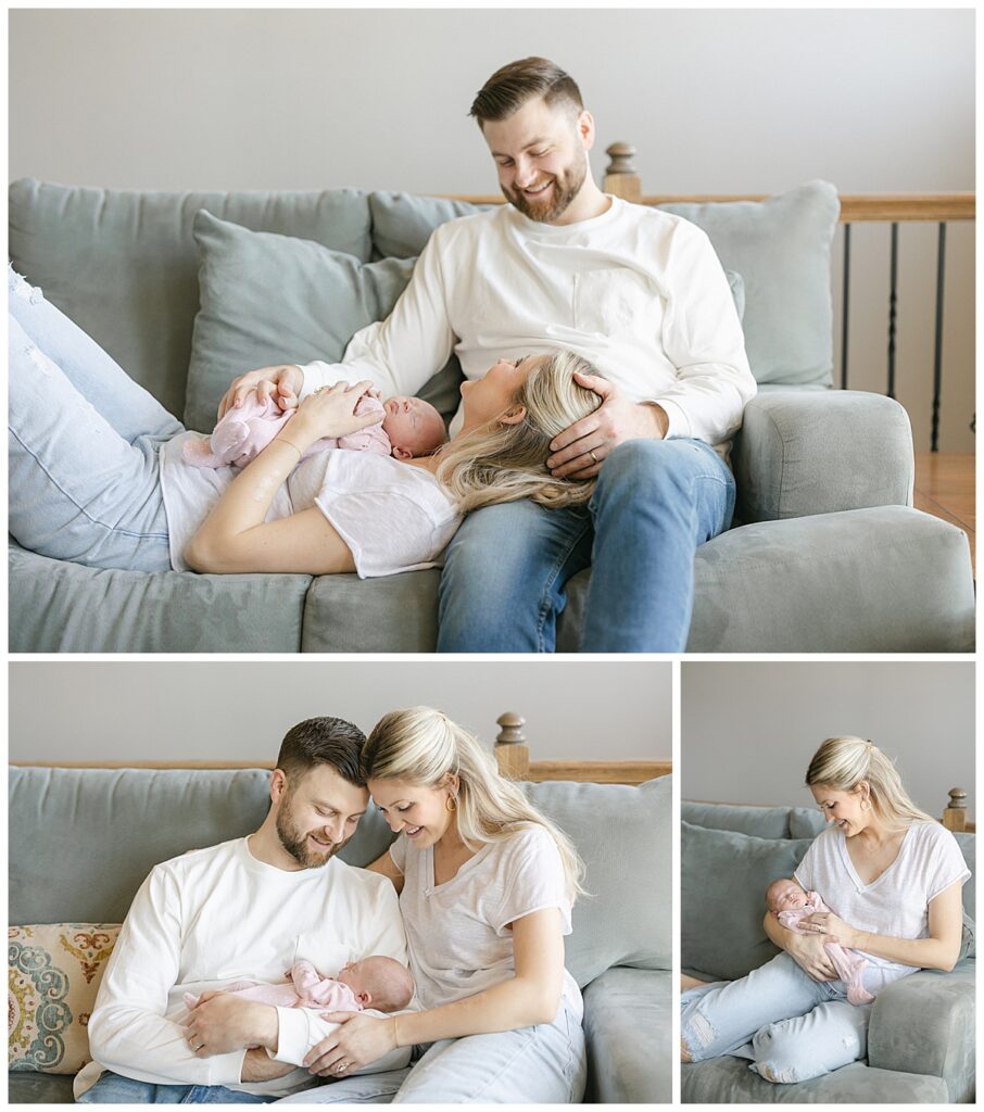 mom and dad on couch with newborn baby
